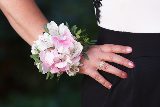 Wrist corsage of hydrangea and alstroemeria flowers on a hand