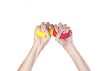 Hands of a woman squeezing a stress balls