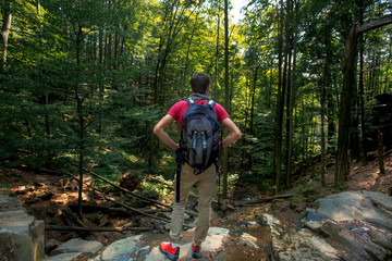 hiker looks over valley