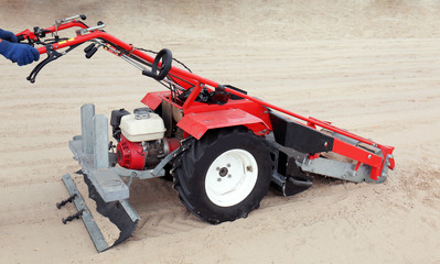 Beach cleaner machine on the seacoast