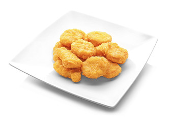 Tasty chicken nuggets on plate, isolated on white
