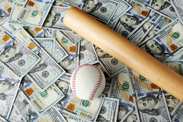 Baseball-bat and ball on dollars