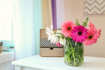 Beautiful flowers in vase on table