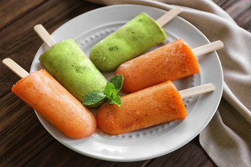 Tasty fruit ice-cream on plate, closeup