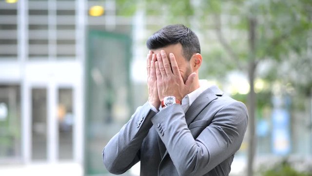Stressed young manager outdoor