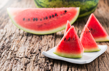 red slice watermelon on white dish