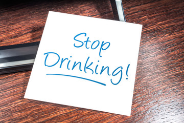 Stop Drinking Reminder On Paper On Wooden Cupboard