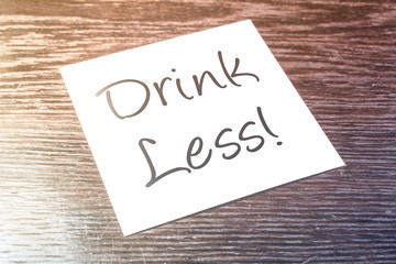 Drink Less Reminder On Paper On Wooden Cupboard