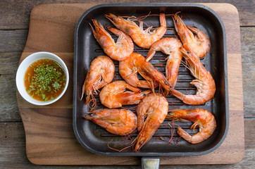 Grilled prawns served with spicy sauce