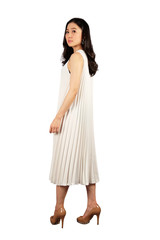 Young Asian woman in white dress on white background