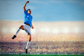 soccer football player in blue team concept celebrating goal in