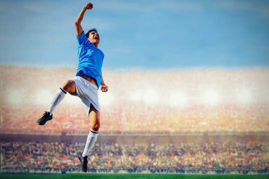 Fototapeta soccer football player in blue team concept celebrating goal in