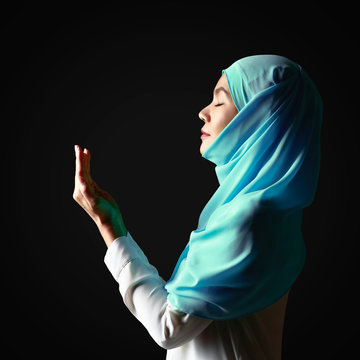 Muslim Woman Praying On Black Background