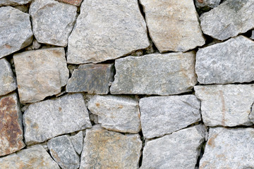 old stone wall Texture in weathered and have natural surfaces.