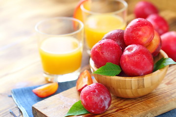 Plum juice and ripe fresh fruit