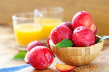 Plum juice and ripe fresh fruit