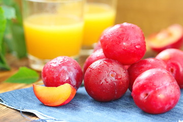 Plum juice and ripe fresh fruit