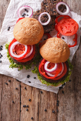 Obraz na płótnie Canvas bean veggie burgers with vegetables close-up. Vertical top view 