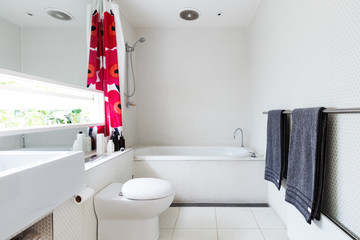 Contemporary white bathroom of mosaic and terrazzo tiles
