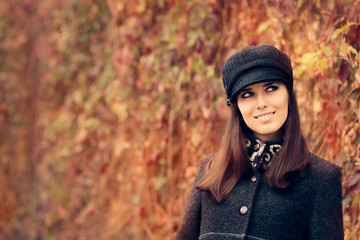 Fototapeta na wymiar Autumn Fashion Woman Wearing Trendy Hat and Coat