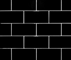 Black and white tile wall for background 