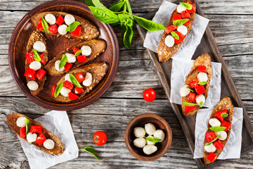 bruschetta with caprese salad on rye baguette with seeds
