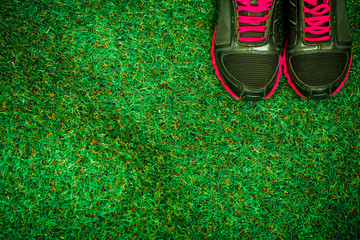 sports shoes on the background of green grass