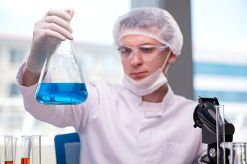 Young chemist working in the lab