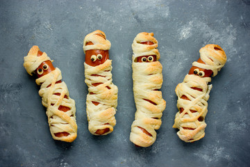 Funny idea for kids for Halloween food - sausage in dough as a mummy