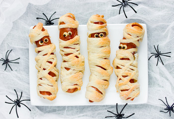 Funny idea for kids for Halloween food - sausage in dough as a mummies