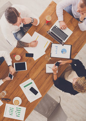 Group of busy business people working in office, top view