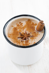 Masala tea in a white cup, closeup vertical