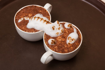 Coffee with foam in the form of cat and mouse