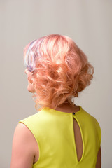 Portrait of a beautiful woman with multi coloured strand in hair, professional hair colouring