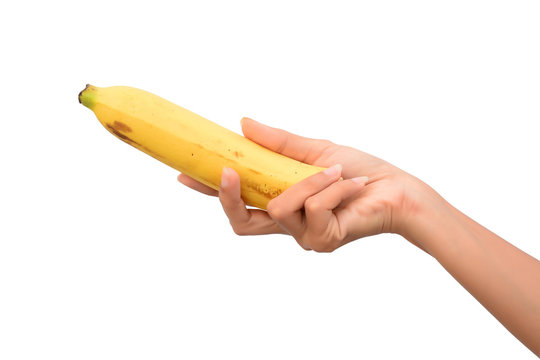hand holding a banana