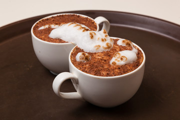 Coffee with foam in the form of cat and mouse