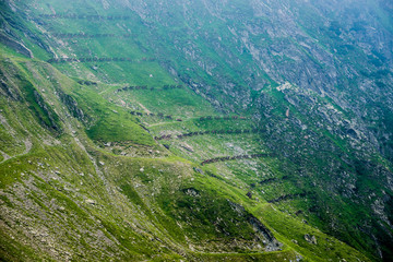 Obraz premium Snow fences on the slope next to Transfagarasan Road in southern section of Carpathian Mountains in Romania