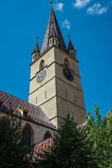 Fototapeta na wymiar Tower of Saint Mary Lutheran Cathedral in Sibiu city in Romania