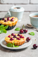 Small tarts with fresh cherries
