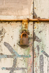 Old industrial door with sliding lock