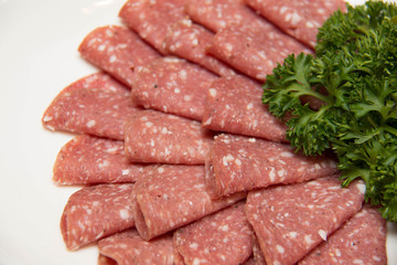Still life with sliced italian salami
