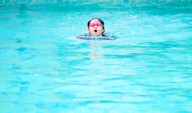 Swimming girl in the swimming pool
