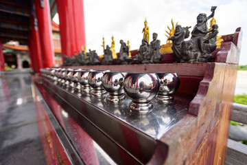 Silver monk's alms bowl and statue in Dragon Temple Kammalawat Temple