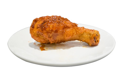 Chicken drumstick fried crispy on white dish isolated on backgro