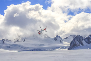 Flying helicopter on glacier
