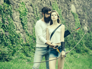 Fototapeta premium Couple is ready to shoot from the bow
