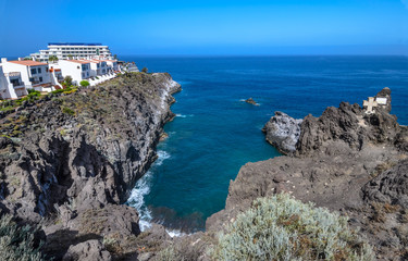 Rugged coastline of Puerto de Santiago is composed of volcanic l