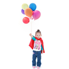 Superhero little asian girl in a red raincoat with balloons on w