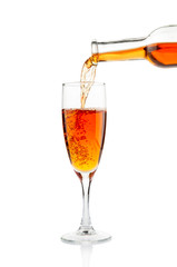 Wine pouring in goblet on white background