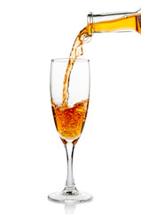 White wine pouring in goblet closeup